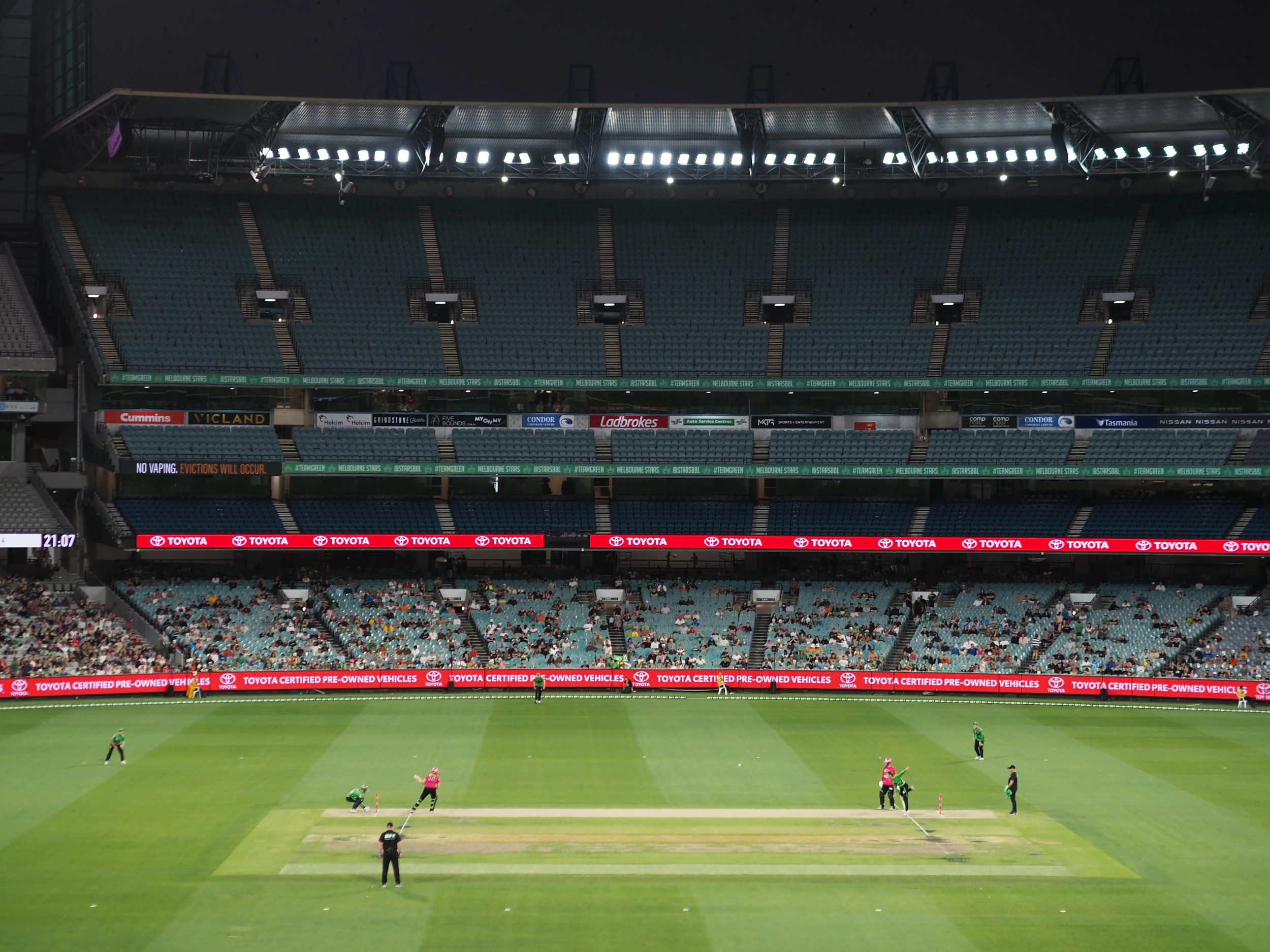 A scene from the game, with the pitch at the bottom and the almost empty stands filling most of the picture. 