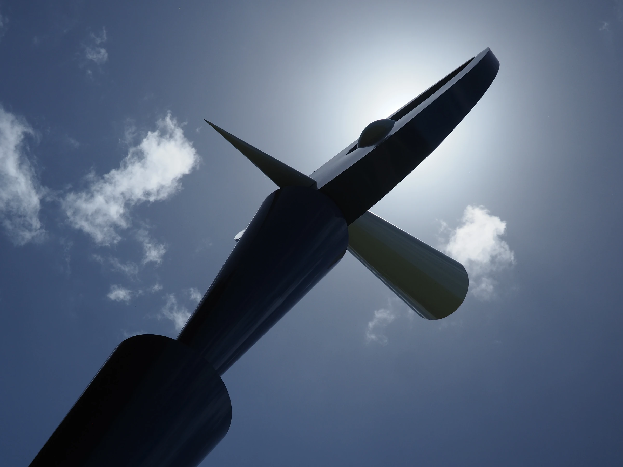 A sculpture photographed against the sun.